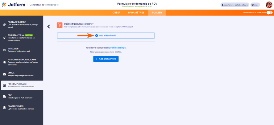 Capture d'écran de la page de configuration de Préremplissage HubSpot dans le Générateur de formulaires Jotform avec une flèche pointant vers le bouton Ajouter un nouveau préremplissage 