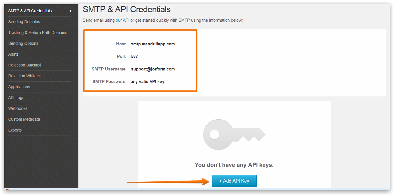Capture d'écran des identifiants SMTP saisis dans le tableau de bord Mandrill avec une flèche pointant vers le bouton Créer une clé API