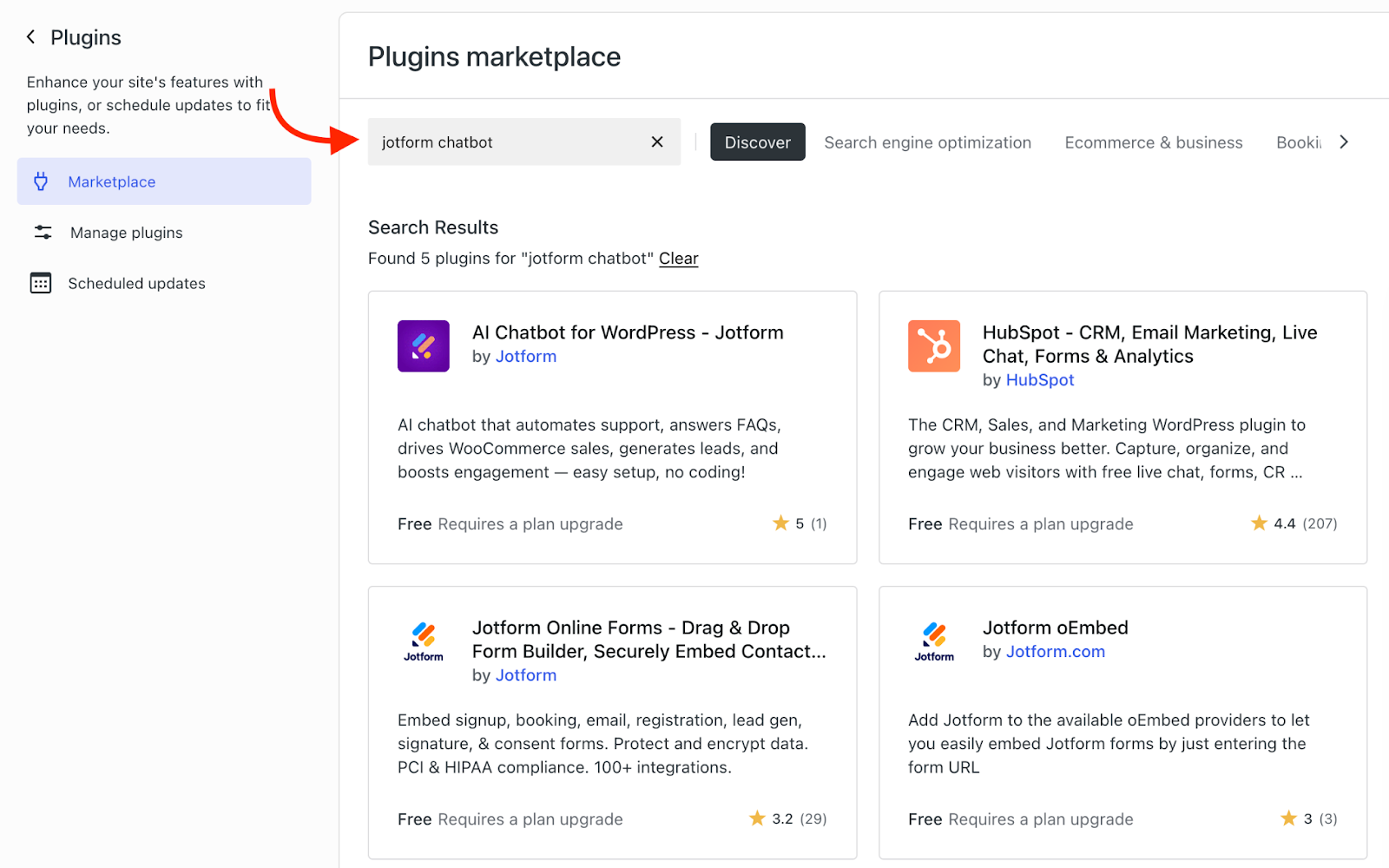 WordPress Plugins Marketplace screen with ‘jotform chatbot’ entered in the search bar, displaying search results including ‘AI Chatbot for WordPress – Jotform’ and other related plugins, with a red arrow highlighting the search field