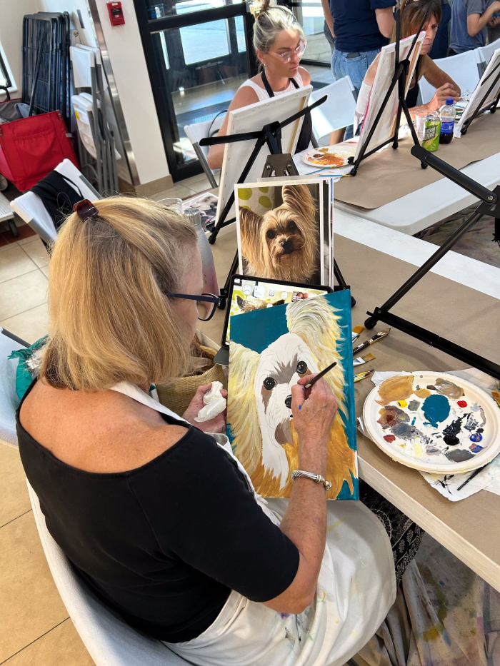 The photo and the painting of a pet from the “Paint Your Pet” fundraising event